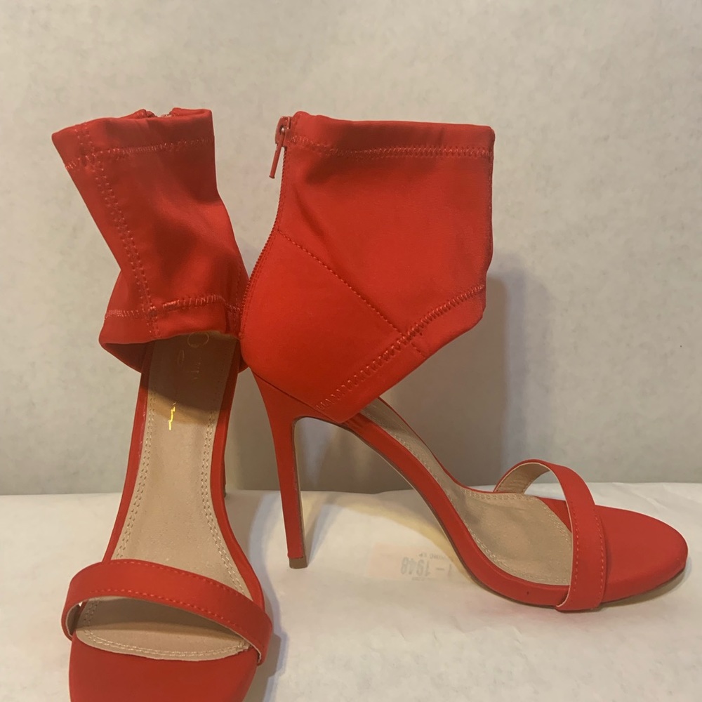 Stylish Lycra ankle strap high heeled sandal.